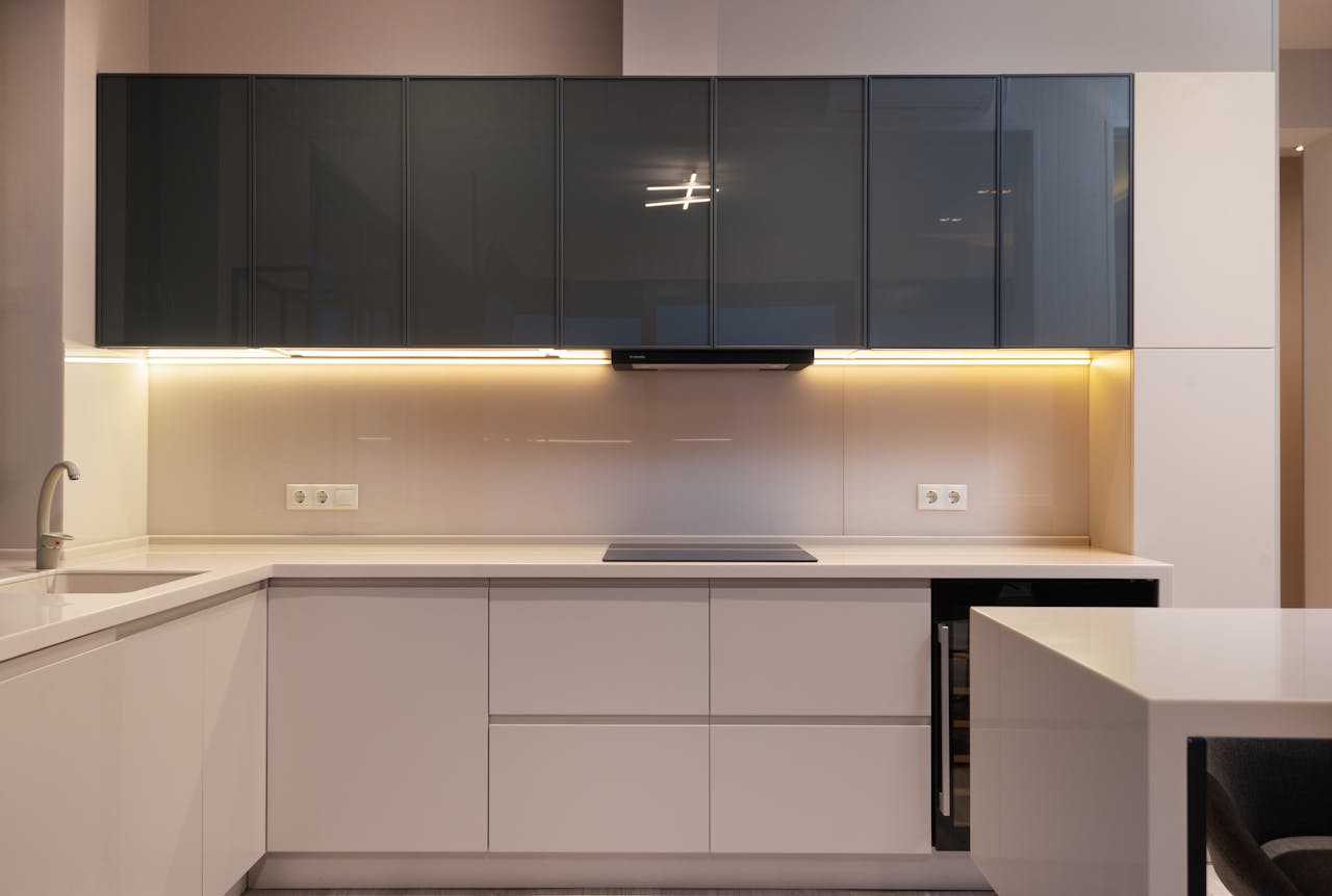 Sleek and elegant modern kitchen interior with minimalist design and integrated appliances.